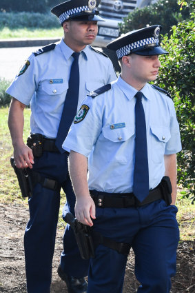 Senior Constable Frederick Tse, left, and Senior Constable Jakob Harrison, right, arrive at the NSW Coroners Court on Friday.