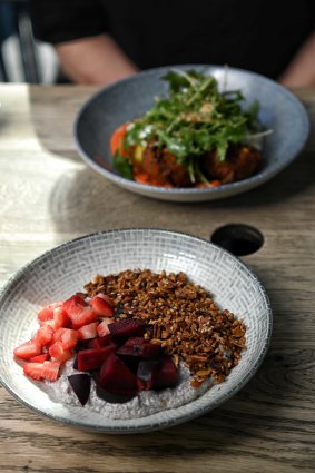  Zucchini and corn fritters, served with romesco, tahini yogurt, avocado and soft eggs, chia with coconut yogurt, served with red plums and strawberries and house granola.