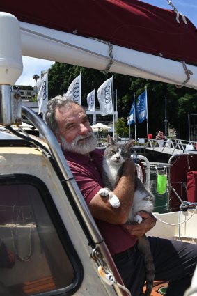 Bob Williams with his cat Oli on board Sylph VI.