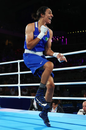 Khelif performs a celebratory high step after beating Thailand’s Janjaem Suwannapheng.