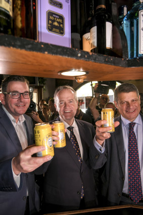 Opposition leader Bill Shorten and Premier of Victoria Daniel Andrews with former Premier Steve Bracks, toast the Labor legend with a Hawke's tinny. 