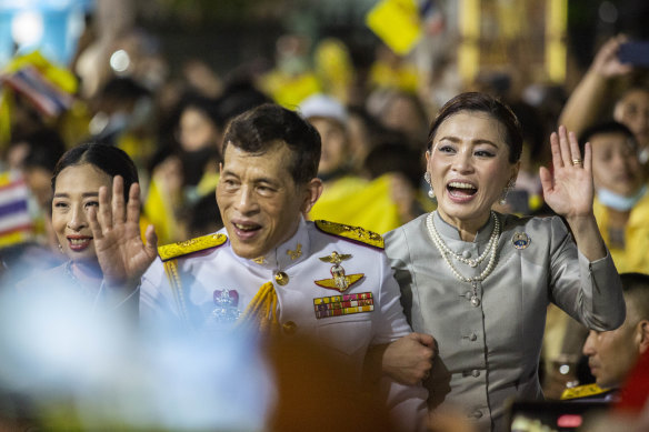 King Maha Vajiralongkorn, considered the world's richest monarch, and Queen Suthida greet supporters of the Thai monarchy on November 1. 