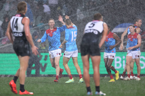 Lachie Hunter scores for the Demons at Adelaide Oval.