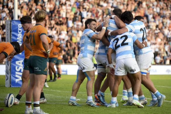 Argentina’s Los Pumas Joaquin Oviedo, center, celebrates with teammates.