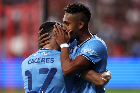 Fabio Gomes celebrates his second goal with Anthony Caceres.