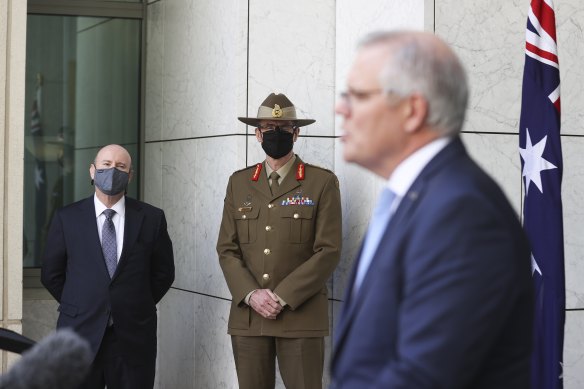 Secretary of the Department of Defence Greg Moriarty, Chief of the Defence Force General Angus Campbell and Prime Minister Scott Morrison announce the new subs deal.