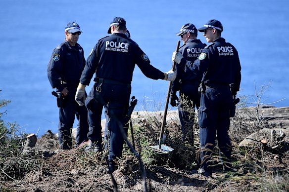 Police undertake a search at North Head near Manly.