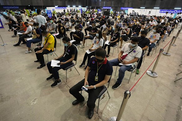 People in Bangkok wait after receiving China’s Sinovac vaccine. 