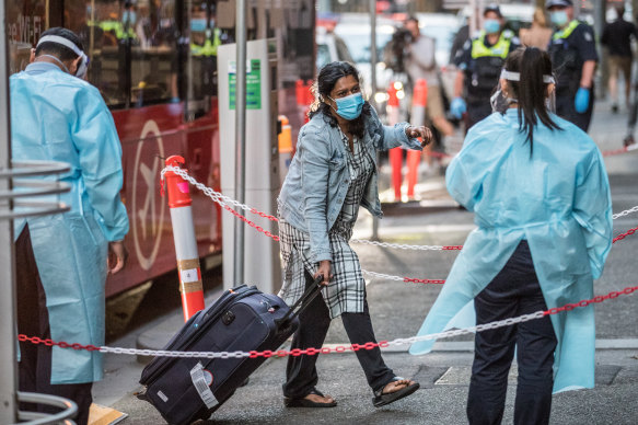 International return travellers arriving at hotel quarantine in Melbourne.