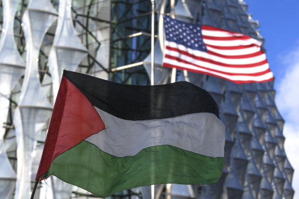 A Palestinian flag is waved outside an American embassy in London in 2020.