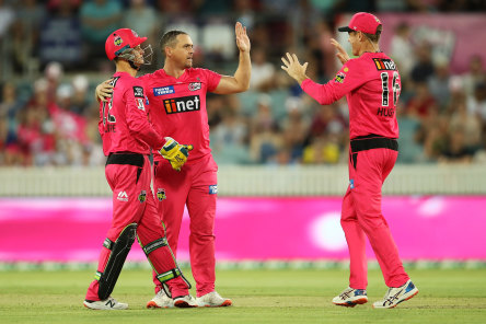 Stephen O’Keefe celebrates the controversial wicket of Mitch Marsh.