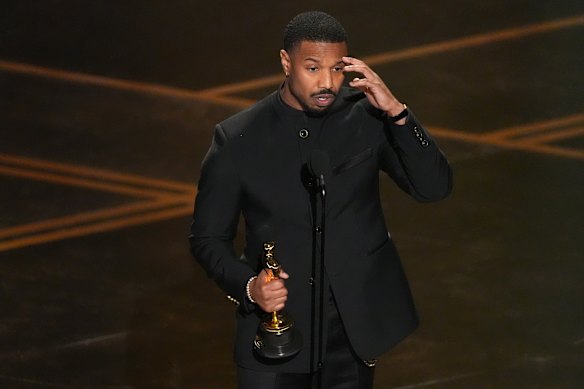 Michael B. Jordan accepts his Oscar for best actor.