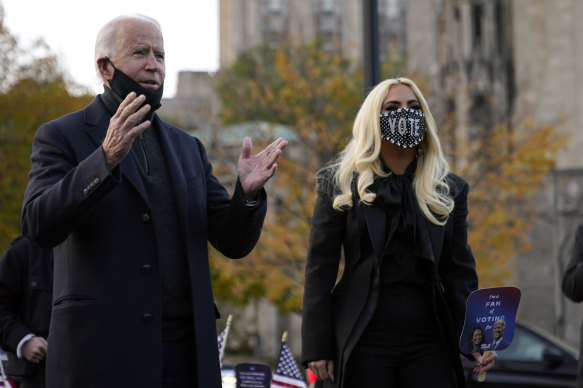 Joe Biden stands with Lady Gaga at a rally just before election day. 