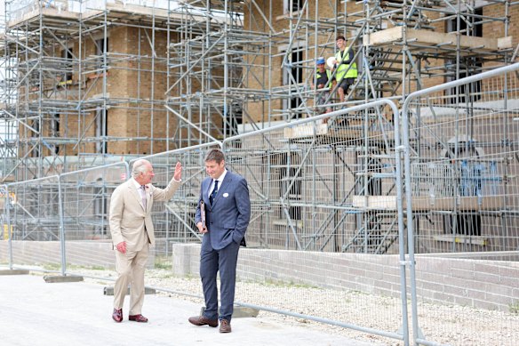 King Charles greets workers as he visits the Duchy’s Poundbury construction site in 2023.  
