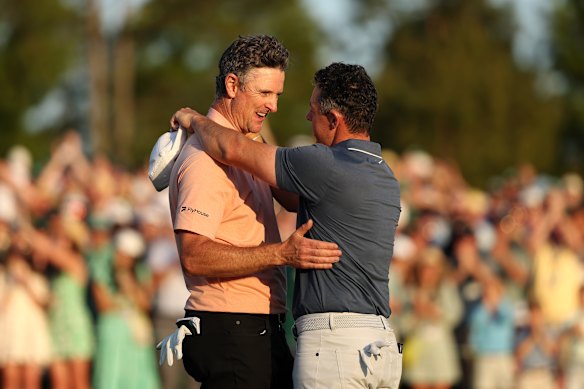 McIlroy embraces Justin Rose after the dramatic climax to the Masters.