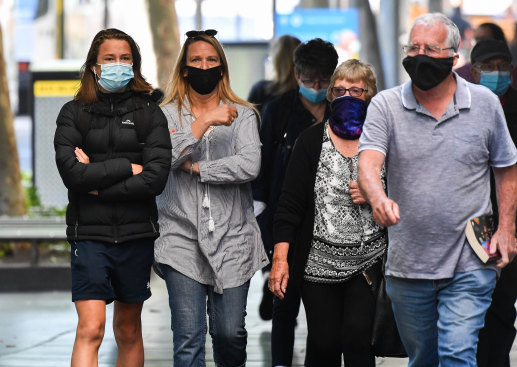 A common sight: People wear masks on the street in Melbourne.