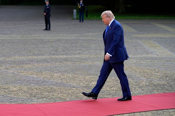 Donald Trump arrives for dinner during the NATO summit on Tuesday.