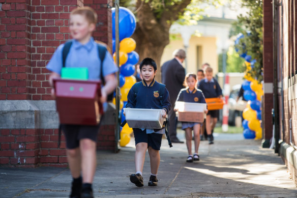 Students at St Brendan's Primary School in Flemington return to school on Monday. 