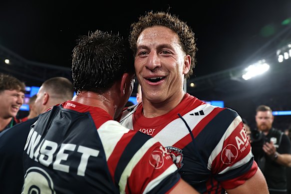 Mark Nawaqanitawase and Reece Robson of the Roosters celebrate victory.