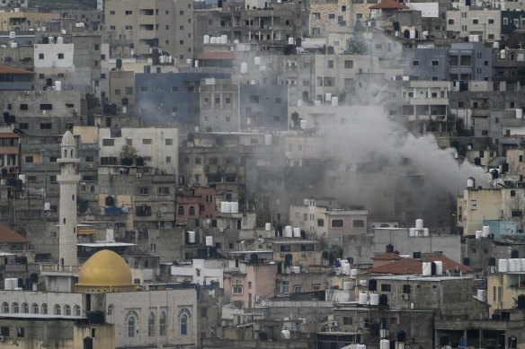 Smoke rises during an Israeli army operation in the West Bank refugee camp of Nur Shams this week.