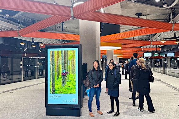 Commuters wait for the first train at Anzac station.