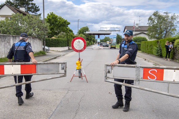 Border guards open the border crossing in Thonex, near Geneva in Switzerland, on Sunday.
