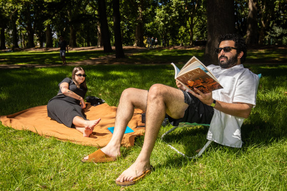 Claire Pocock and Anthony D’Cruz enjoy some downtime at Carlton Gardens on Australia Day.
Photo: Scott McNaughton / The Age