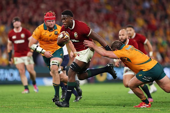 Marohie of the British and Irish lions run with the ball against the wallabies.