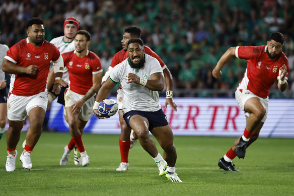 Ireland’s Bundee Aki makes a break against Tonga.