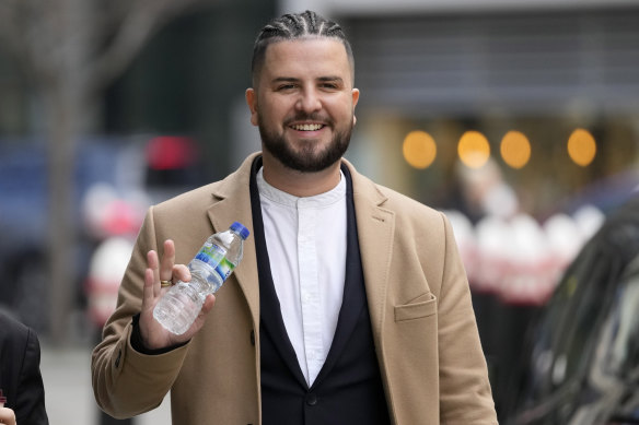 Sami Chokri waves outside the High Court in central London in March. 
