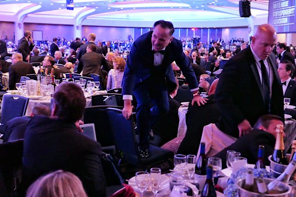 White House deputy chief of staff Dan Scavino jumps over a chair in the immediate aftermath of the incident.