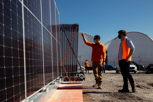 5B staffer Victor Rego (left) shows new head of product development Lloyd Niccol a set of the firm’s pre-fabricated solar modules in Kurnell, Sydney. 