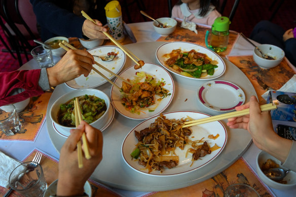 The Cao family from China enjoy a meal at the Golden Crown in Ballarat.