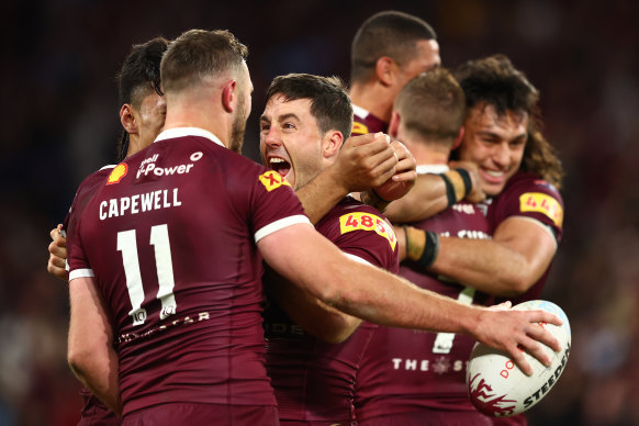 Ben Hunt is mobbed after his series-sealing try.