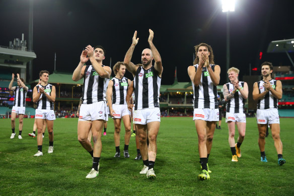 Collingwood celebrate their win over Melbourne at the SCG. 