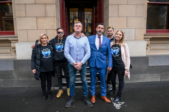 Declan Cutler’s dad Bryan Beattie (centre) with family and friends outside the Supreme Court in August.