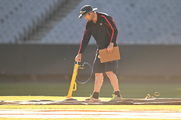 MCG curator Matt Page inspects the deck on Christmas morning.