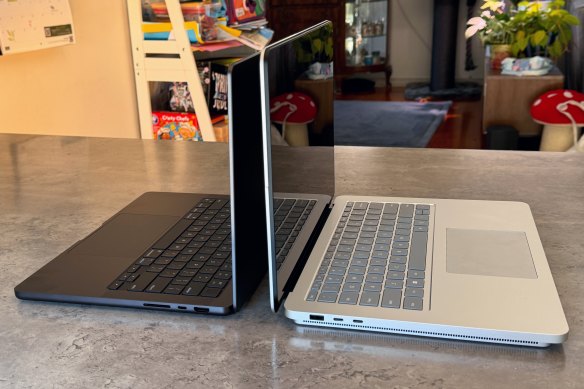 The Surface Laptop Studio 2 (right) is bigger and heavier than the latest MacBook Pro, but whether it’s more powerful depends on how you configure the devices.