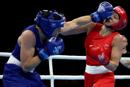 Rosie Eccles punishes Kaye Scott in their gold-medal bout.