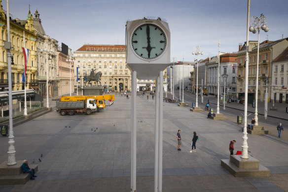 A view of the clock at an almost empty main square because of the coronavirus lockdown in Zagreb, Croatia.