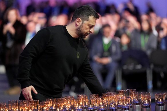 Ukrainian President Volodymyr Zelensky lays a candle during commemorations at Auschwitz-Birkenau in Poland to mark 80 years since the liberation of the concentration camp.