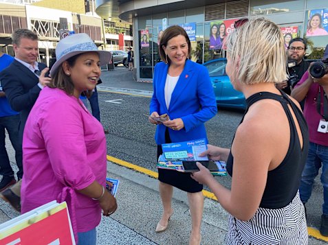 Then-McConnel candidate Pinky Singh (left) and then-LNP leader Deb Frecklington (centre) speak with a voter at the Fortitude Valley early-polling booth before the 2020 election.