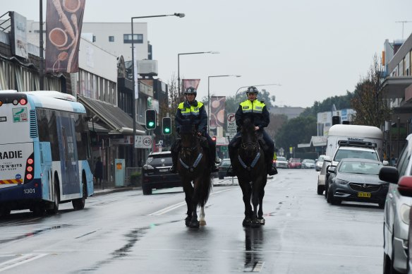 NSW Mounted Police patrol the streets of Fairfield in Sydney’s south west during the city’s COVID-19 lockdown.