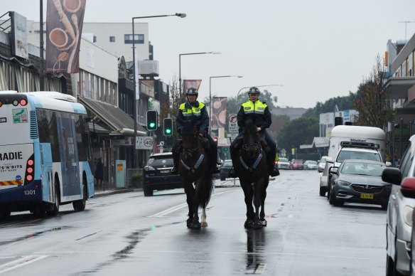 NSW Mounted Police patrol the streets of Fairfield in Sydney’s south west during the state’s COVID-19 lockdown.