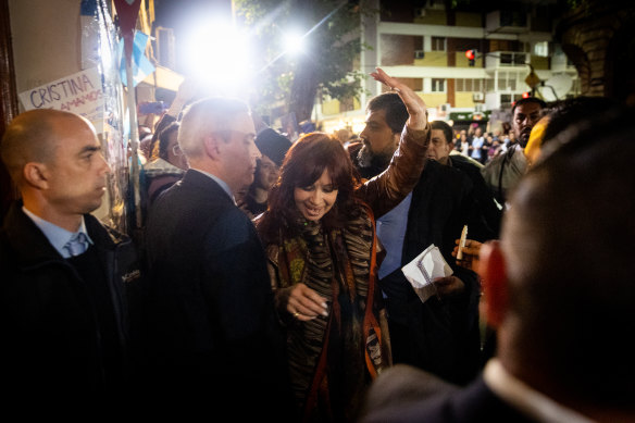 Vice President Cristina Fernandez Kirchner waves at supporters as she arrives home.