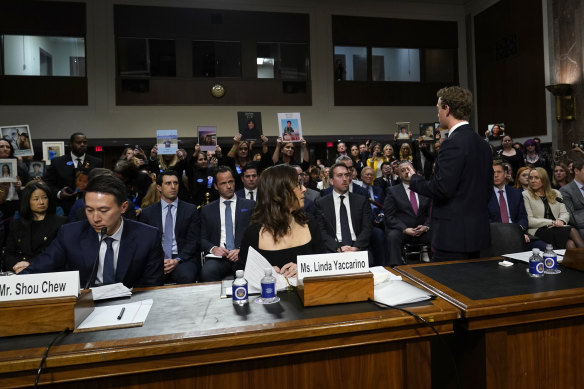 Meta CEO Mark Zuckerberg addresses the crowd during a Senate Judiciary Committee hearing on Capitol Hill in Washington to discuss child safety.  TikTok CEO Shou Zi Chew and X CEO Linda Yaccarino listen.