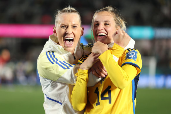 Stina Blackstenius and Nathalie Bjorn of Sweden celebrate their team’s triumph over Japan.