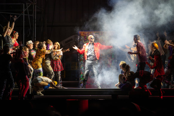 The character of Escamillo and the Opera Australia Chorus in Opera Australia’s 2022 production of Carmen on Cockatoo Island.