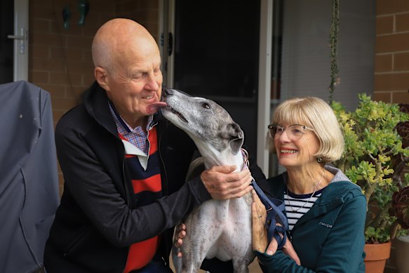 Neil and Libby Jones with their rescue greyhound, Sammy. Neil has been a key part of the push against a new track in Orange.