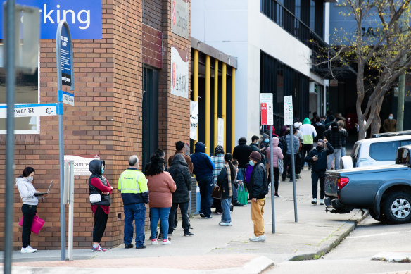 People line up around the block for Centrelink in Campsie, in south-west Sydney. Google searches for the word “Centrelink” have soared since the start of the Sydney lockdown.